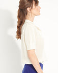 AVA 1 Short-sleeved cashmere polo shirt in off-white pointelle knit